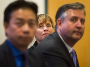 September 2019: Shauna Sylvester, center, listens as she's seen between Ken Sim, left, and Kennedy Stewart during a debate for mayoral candidates in Vancouver before the 2018 election.