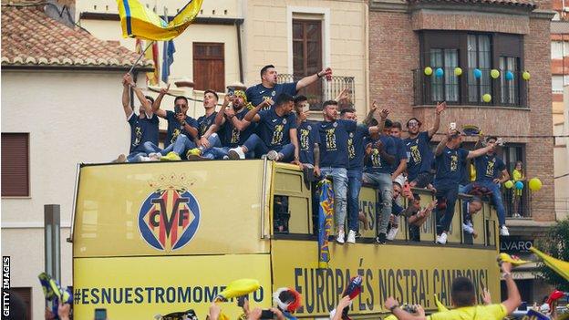 Villarreal celebrate winning the Europa League on a bus parade