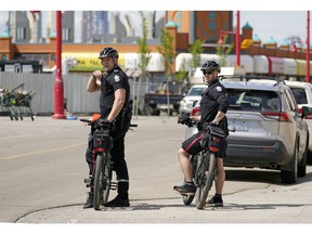 Police patrol the downtown Edmonton Chinatown district on Thursday May 26, 2022 after two recent random murders in the area.