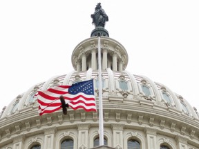 The US flag flies over the US Capitol in Washington, DC, April 26, 2022.