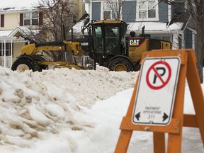 City of Edmonton crews remove snow from the roads in Edmonton's Griesbach neighborhood on Jan. 21, 2022.
