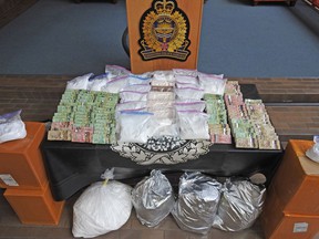 Edmonton police have charged four Edmonton men and seized more than .3 million in drugs and cash following a 14-month organized crime investigation.