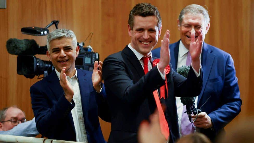 London Mayor Sadiq Khan celebrates with the new leader of Wandsworth Council Simon Hogg