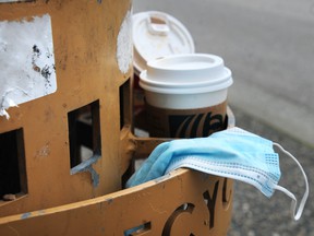 Discarded disposable cups and masks in Vancouver, BC., on May 11, 2022.