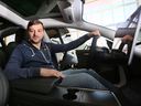 University of Windsor professor Francesco Biondi is shown behind the wheel of a Tesla at the campus on Tuesday, May 17, 2022. Biondi conducted a study on driving habits during the pandemic.