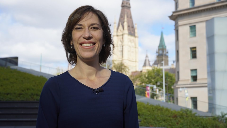 Sophie Chatel poses with Parliament in the distance, in Ottawa.