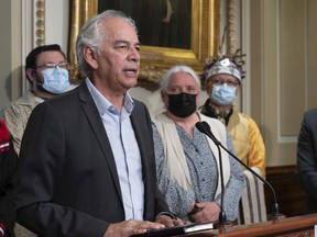 Ghislain Picard, head of the Quebec-Labrador Assembly of First Nations, comments on Bill 96 at a press conference Tuesday, May 10, 2022, at the Quebec City legislature.  Quebecois supporter MNA Manon Massé and Kevin Deer look on.