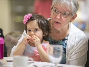 Emelia Moran, 2, and her grandmother, Nadia Pecile, enjoy a Mother's Day brunch at the Fogolar Furlan on Sunday.