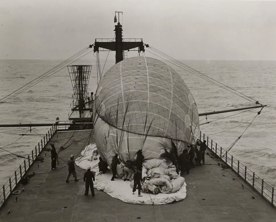 The US Coast Guard removes a hot air balloon's restraining net in this file photo.  Such balloons carried leaflets into Communist East Germany, just one example of western governments' creative efforts to undermine Soviet propaganda.