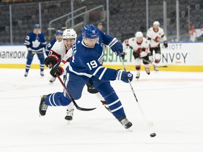 Maple Leafs forward Jason Spezza is pursued by Ottawa Senators winger Alex Formenton during a game this season.  Spezza, who started his career in Ottawa and finished with 251 goals, 436 assists and 687 points in 686 games with the Senators, retired on Sunday.