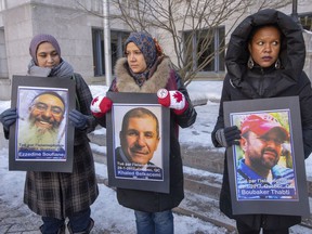 Photos of victims of the Quebec City mosque massacre are displayed during a vigil in Montreal marking the anniversary of the tragedy on January 29, 2020.