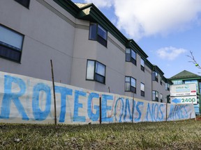 A sign calling to protect our seniors was erected outside Residence Herron in Dorval on Wednesday, April 15, 2020.