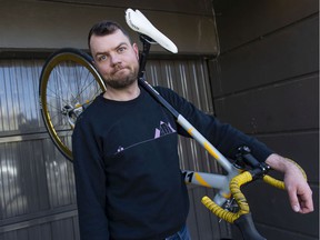 Ben Bolliger holds his broken bicycle in March after getting a bill for more than ,000 for a crash in which he was seriously injured.