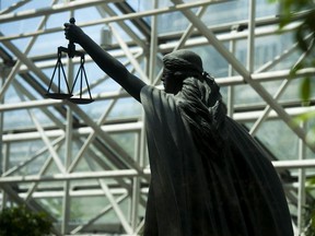 Scales of Justice statue at BC Supreme Court in Vancouver.