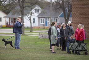 Frazier Fathers leads a Jane's Walk through the Marlborough neighborhood of West Windsor on Friday, May 6, 2022. His dog Izzy appears more interested in walking over talking.