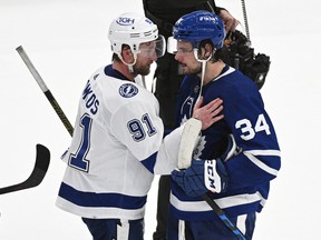 Maple Leafs star Auston Matthews (right) shakes hands with Tampa Bay Lightning captain Steven Stamkos after Toronto was knocked out of the playoffs on Saturday night at Scotiabank Arena.