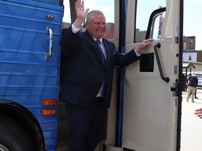 Ontario PC party leader Doug Ford waves from his bus as he arrives at the Federation of Northern Ontario Municipalities debate held at the Capitol Center in North Bay, Ont.  on Tuesday, May 10,2022.