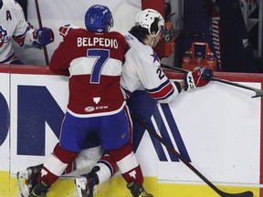 Louie Belpedio of the Laval Rocket checks Jack Quinn of the Rochester Americans in the second period of Game 2 against the Rochester Americans at Place Bell on May 23, 2022.