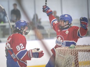 LAKESHORE, ONTARIO:.  MAY 8, 2022 - Lakeshore's Sebastien Tronchin, left, and Marco Sladoje, celebrate a first period goal during a Schmalz Cup round-robin game against the Stayner Siskins at the Atlas Tube Centre, on Sunday, May 8, 2022.