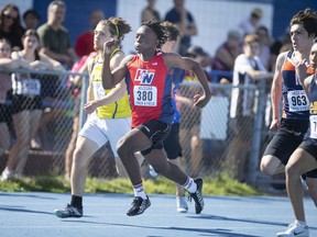 Holy Names Knights' sprinter Semi Mugenzi competes in the junior boys' 200 meters during Thursday's WECSSAA track and field championships at Sandwich Secondary School.