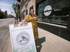 Allison Mistakidis, co-owner of Whiskeyjack Boutique on University Avenue West is shown in front of the business on Tuesday, May 10, 2022. She supports the city's proposal to improve pedestrian traffic on the street.