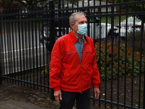 A man who identified himself as Richard Demontigny arrives at Premier John Horgan's constituency office in Langford, on Monday, May 30, 2022, before turning himself in to RCMP after fresh manure was dumped at the community office last week to protest for saving old-growth forest on Vancouver Island.