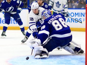 Tampa Bay's Andrei Vasilevskiy stops a shot from the Leafs' Mitch Marner at Amalie Arena last night.  Getty Images