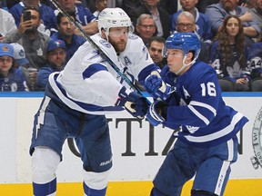 Lightning defenseman Victor Hedman, left, battles against Maple Leafs forward Mitch Marner during Game 5 of the first round of the 2022 Stanley Cup Playoffs at Scotiabank Arena in Toronto, Tuesday, May 10, 2022.
