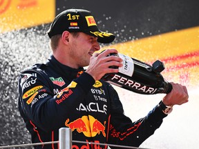 Race winner Max Verstappen celebrates on the podium during the F1 Grand Prix of Spain at Circuit de Barcelona-Catalunya on May 22, 2022 in Barcelona, ​​Spain.