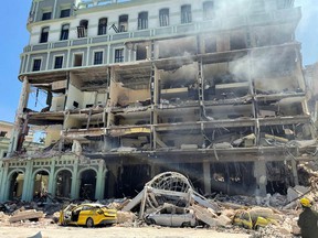 Debris is scattered after an explosion destroyed the Hotel Saratoga, in Havana, Cuba, on May 6, 2022.