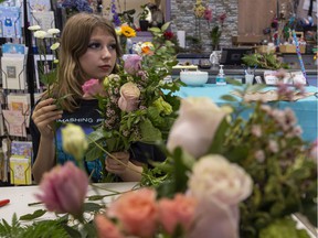 Miki Morrison, 13, Is part of a group of children from single-mom families taking part in a special training day as they learn how to make a floral bouquet for Mother's Day.  These children demonstrate what children will be doing at an upcoming Love You Mama event on May 7th at Londonderry Mall. Taken on Tuesday, April 26, 2022 in St Albert .  Greg Southam - Postmedia