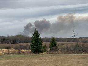 A wildfire burns in Parkland County near the village of Tomahawk on May 7, 2021.