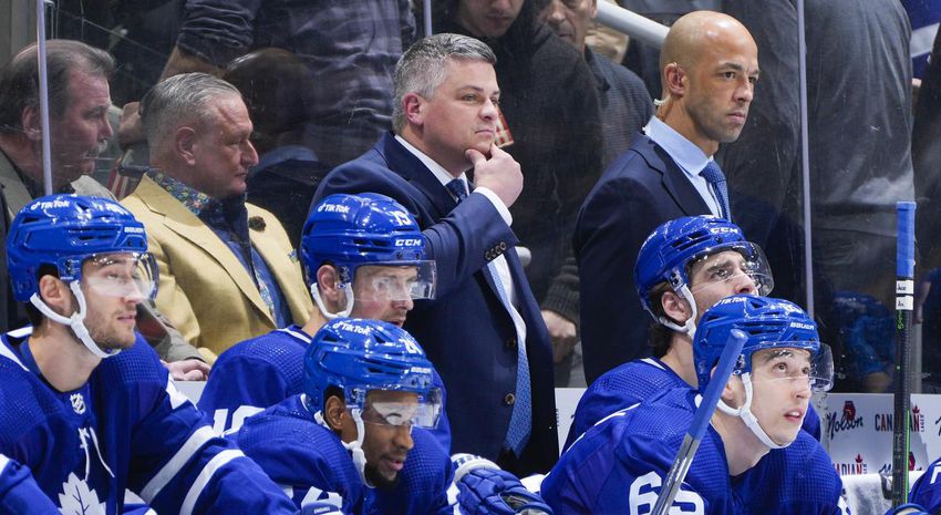 Leafs head coach Sheldon Keefe, center, has not been outcoached by Tampa Bay counterpart Jon Cooper, despite some second-guessing of his lineup decisions.