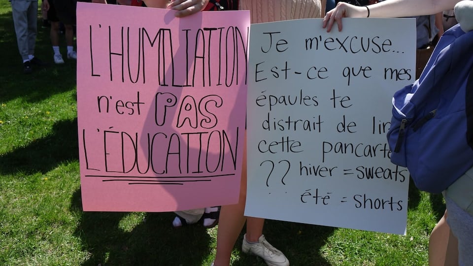 The students held up signs during the demonstration.