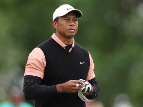 Tiger Woods stands on the 16th hole during the third round of the PGA Championship at Southern Hills Country Club on Saturday.  Woods shot a nine-over-par 79, the worst score of his career at this major championship.