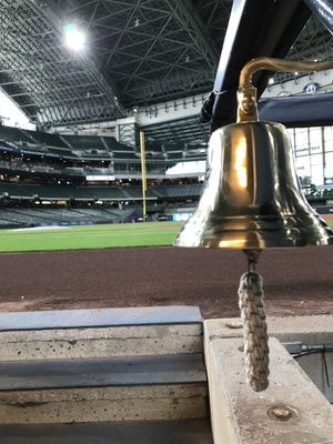 The 'Ballplayer Bell' at the end of the dugout at American Family Field had a healthy workout during his first game on May 4.