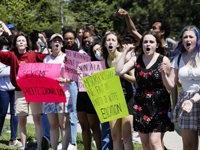 Students at the Béatrice-Desloges Catholic High School protest against the enforcement of the school's dress code on May 13.