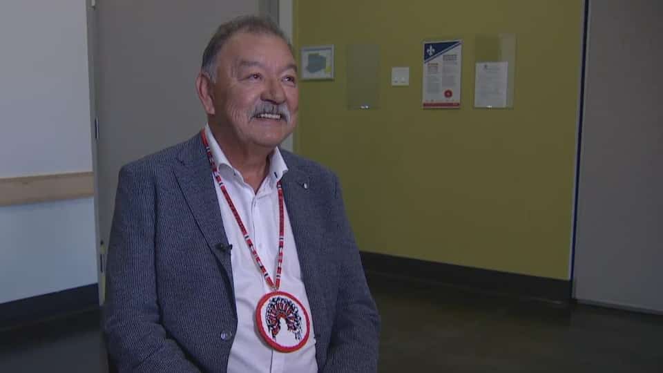 George Arcand Jr seated in a chair.