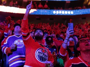 Hockey fans sing the national anthem as the Edmonton Oilers play the LA Kings during first round NHL Stanley Cup playoffs Game 7 action at Rogers Place in Edmonton, on Saturday, May 14, 2022.