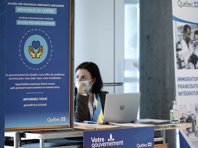 A booth at Pierre Elliott Trudeau airport is set up to greet potential Ukrainian refugees.