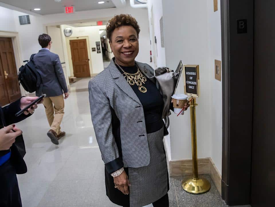 Representative Barbara Lee poses for a photo next to an elevator in one of the Capitol's underground corridors.