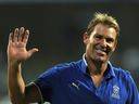 In this file photograph taken on May 20, 2011, Australian bowling legend and Rajasthan Royals' captain Shane Warne waves to the crowd as he leaves the field after his last international match - the IPL Twenty20 match between Rajasthan Royals and Mumbai Indians at The Wankhede Stadium in Mumbai.