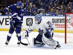 May 12, 2022;  Tampa, FL, USA;  Toronto Maple Leafs goaltender Jack Campbell makes a save as Tampa Bay Lightning left wing Alex Killorn goes after the puck during the third period of game six of the first round of the 2022 Stanley Cup Playoffs at Amalie Arena.