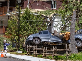 Marc-André Ouellet's Mercedes vehicle was the center of everyone's photos after the storm smashed his camper van in his driveway in Morin-Heights on Tuesday May 24, 2022.