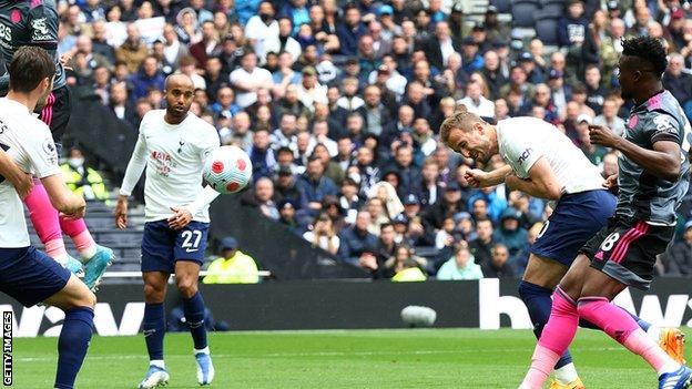 Harry Kane heads in Tottenham's opening goal against Leicester