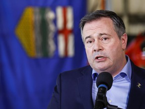 Jason Kenney speaks in Calgary on March 25, 2022. The Alberta premier, buffeted by party infighting and a contentious leadership review, is rejecting speculation he may call an early election as part of a last-ditch effort to maintain control.