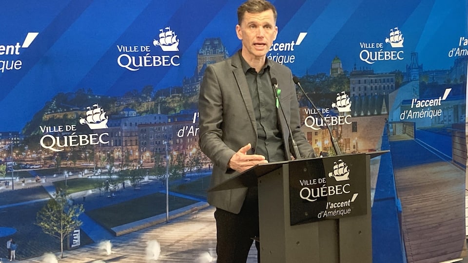 The mayor of Quebec at a press conference.