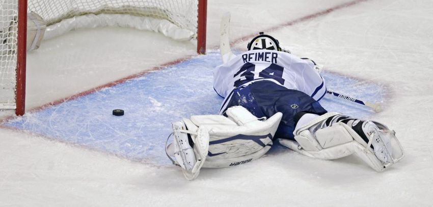 Toronto Maple Leafs goalie James Reimer lays on the ice after getting beat on the game winning goal by Boston Bruins center Patrice Bergeron during overtime in Game 7 of their NHL hockey Stanley Cup playoff series in Boston, Monday, May 13, 2013. The Bruins won 5-4.