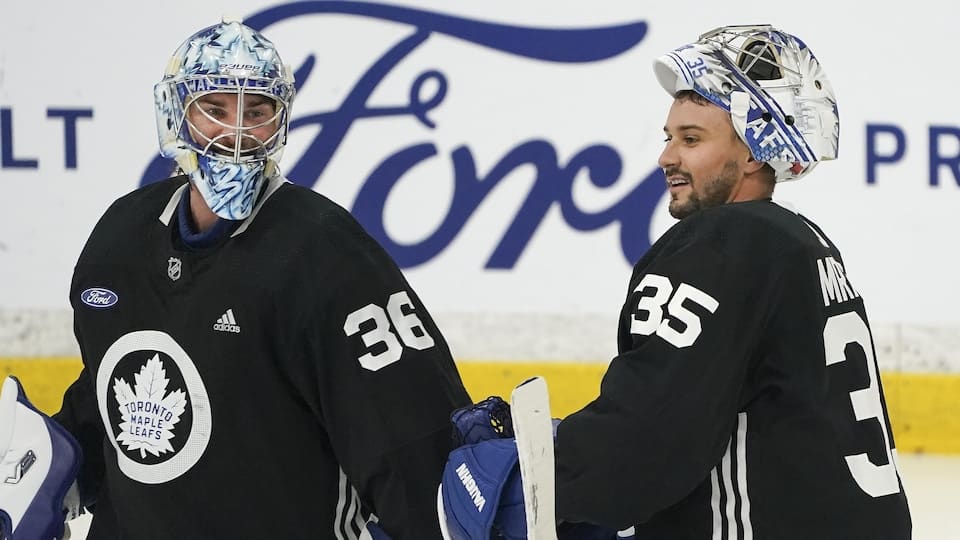 Jack Campbell and Petr Mrazek chat during a Maple Leafs practice.