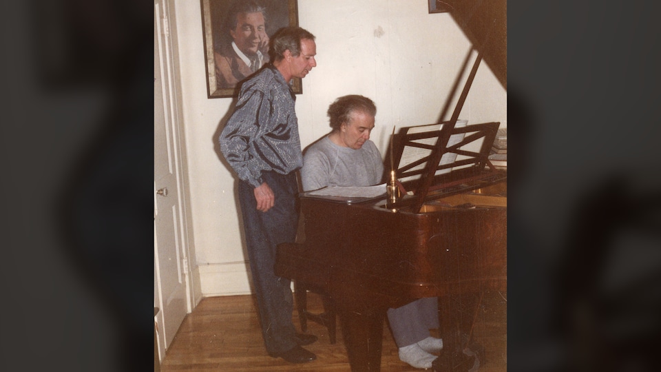 Two men at the piano.